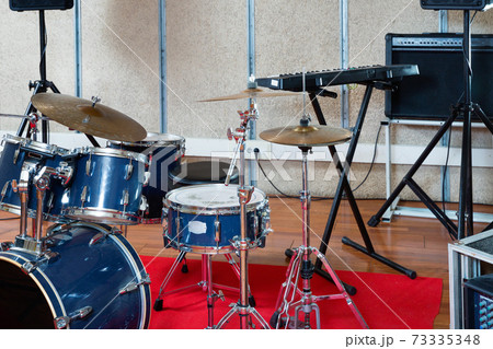 Set of musical instruments ready for rehearsal of music band in modern sound studio 73335348