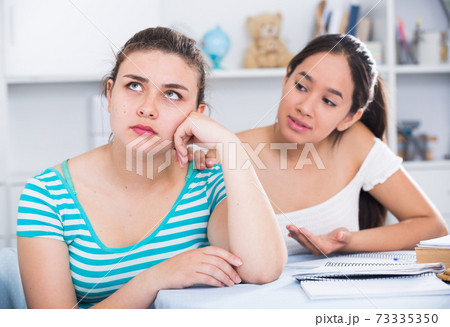 Teen girl trying to apologize after dispute 73335350