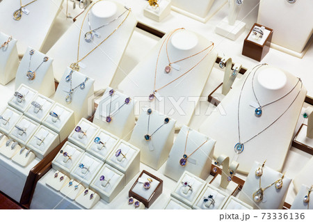 Pendants and bracelets with dimonds in jewelry store 73336136