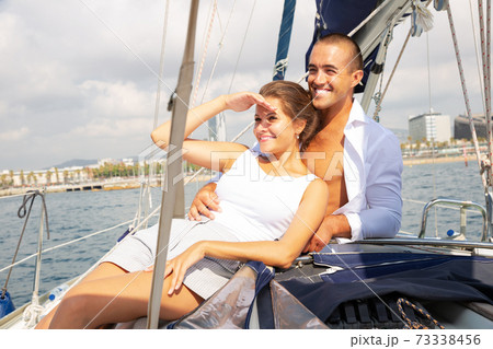 Couple sailing on yacht along Spain Couple sailing on yacht along Spain 73338456