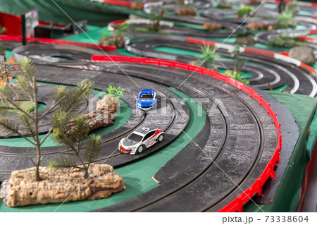 Racing car on the toy race track Racing car on the toy race track 73338604