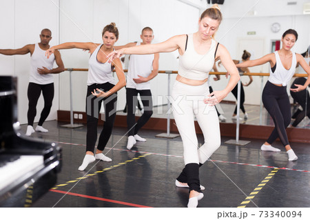 guys and girls performing dance elements guys and girls performing dance elements 73340094
