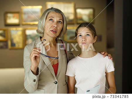 Woman and girl visiting museum Woman and girl visiting museum 73341785
