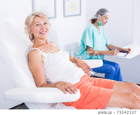 Mature female waiting for cosmetological treatment 73342137