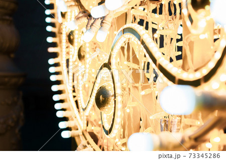 Fragment of christmas street decorations in park, evening photo Fragment of christmas street decorations in park, evening photo 73345286