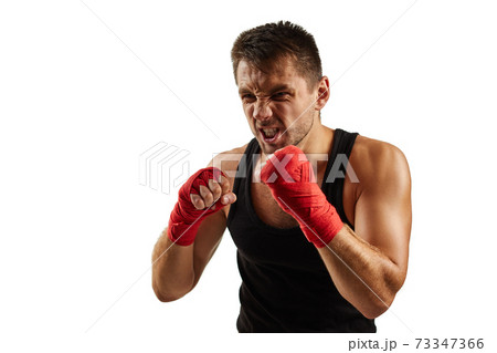 sporty man in red sports bandages on his hands fighting sporty man in red sports bandages on his hands fighting 73347366