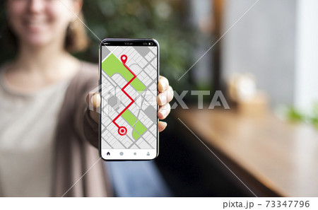 Smartphone With Opened Gps Navigation Online Maps On Screen In Female Hand 73347796