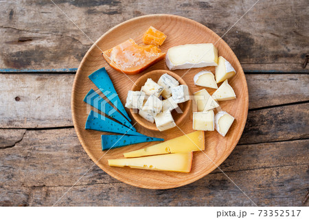 Top view of set cheese board on wooden background 73352517