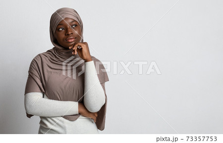 Let Me Think. Pensive Black Woman In Hijab Looking At Copy Space Let Me Think. Pensive Black Woman In Hijab Looking At Copy Space 73357753