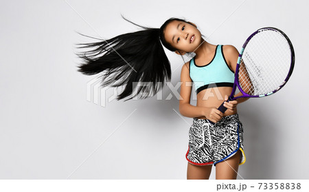 Young asian girl preteen big tennis player studio 73358838