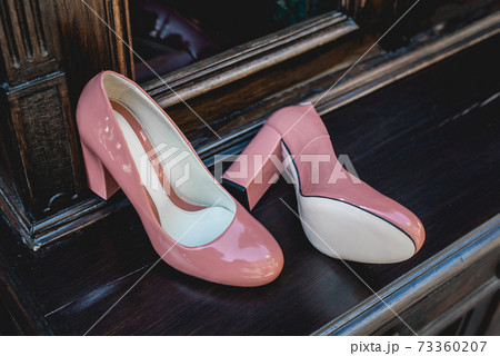 Pair of Womans beige lacquered shoes. Natural light Pair of Womans beige lacquered shoes. Natural light 73360207