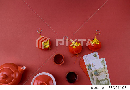 Asian traditional Chinese tea culture with Chinese New Year decoration mandarin orange on red table Asian traditional Chinese tea culture with Chinese New Year decoration mandarin orange on red table 73361103
