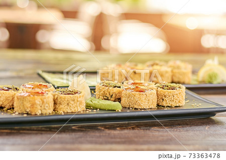 Set of unagi sushi rolls, blurred background. 73363478