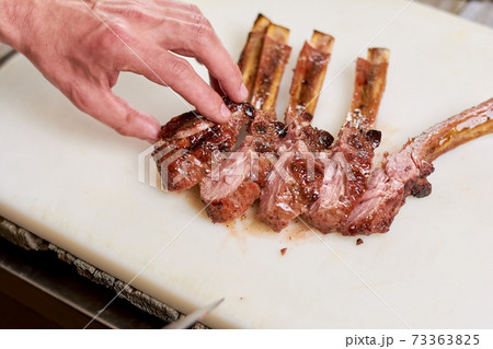 Fresh cooked ribs calf on white background. 73363825