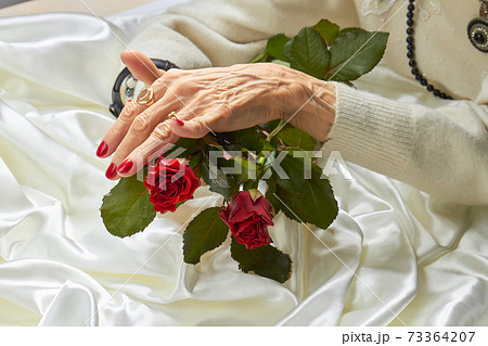 Luxury woman hands and red roses. Luxury woman hands and red roses. 73364207