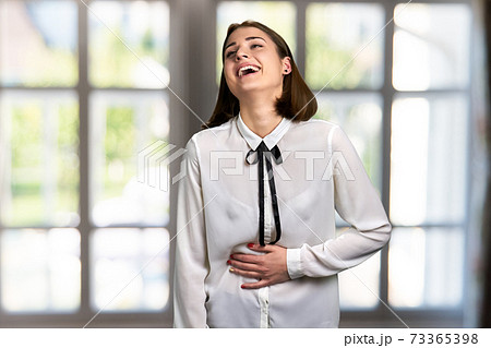 Attractive woman bursting in laugh. Attractive woman bursting in laugh. 73365398