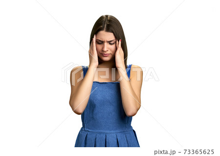 Portrait of girl with terrible headache. Portrait of girl with terrible headache. 73365625