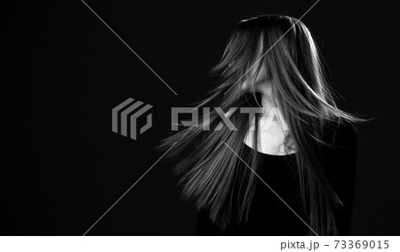 Black and white portrait of young happy woman with Black and white portrait of young happy woman with 73369015