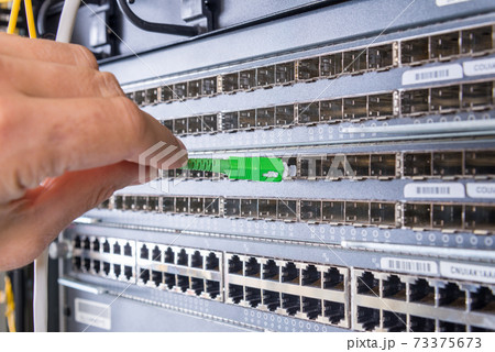 hand with fiber optic cable hand with fiber optic cable 73375673