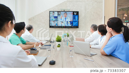 doctors have conference video call 73383307