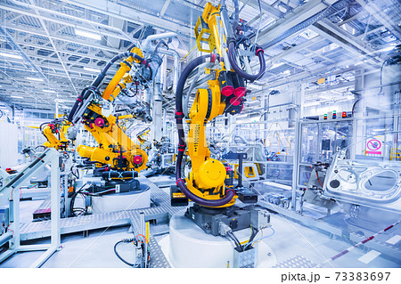 robots in a car factory robots in a car factory 73383697