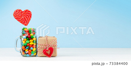 Various candy sweets and heart shaped lollipop Various candy sweets and heart shaped lollipop 73384400