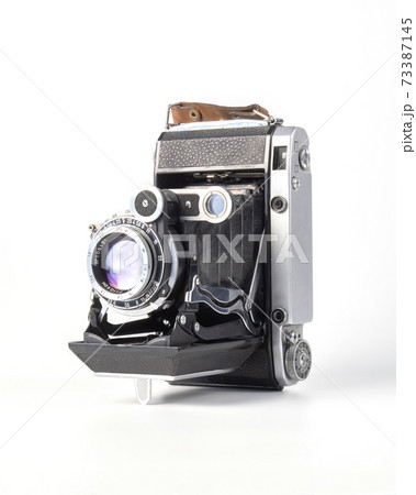 Antique old fasion film camera front view . 73387145