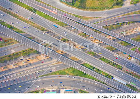 Aerial view of cars driving on highway or moterway. Overpass bridge street roads in connection network of architecture concept. Top view. Urban city, Bangkok, Thailand. 73388052