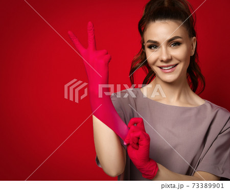 Young smiling pretty brunette woman doctor Young smiling pretty brunette woman doctor 73389901