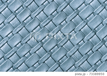 Texture of light blue and denim leather background with wicker pattern, macro Texture of light blue and denim leather background with wicker pattern, macro 73389950
