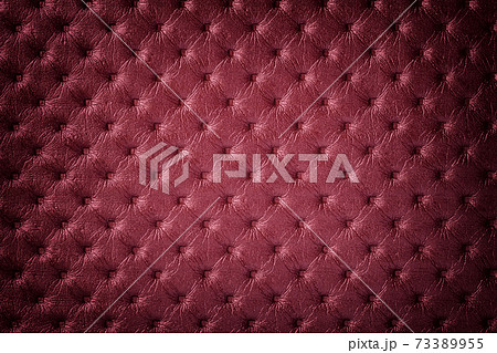 Texture of dark red leather background with capitone pattern with vignette. Texture of dark red leather background with capitone pattern with vignette. 73389955