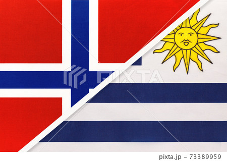 Norway and Uruguay, symbol of national flags from textile. 73389959