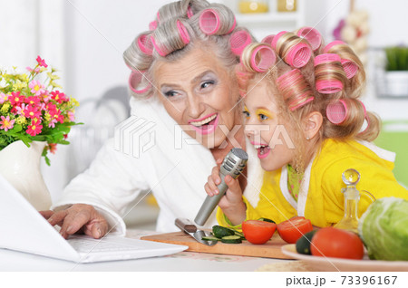 Close up portrait of grandmother with granddaughter at home 73396167