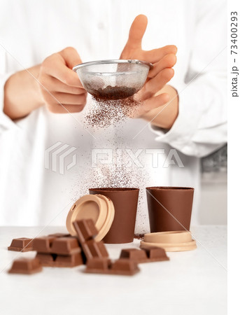 Young woman making chocolate dessert. Delicious food concept. Young woman making chocolate dessert. Delicious food concept. 73400293