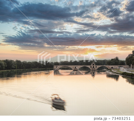 Avignon, famous bridge with Rhone river against sunset in Provence, France 73403251