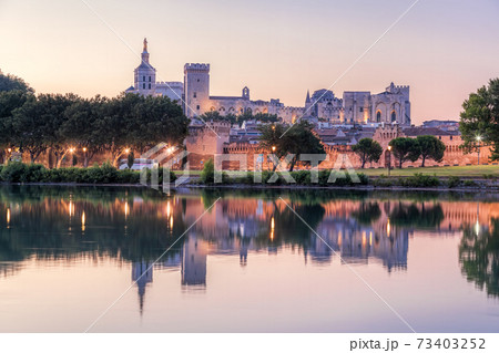 Avignon with Popes Palace during evening in Provence, France 73403252