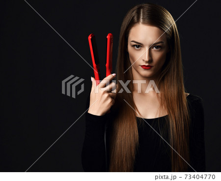 Serious woman young professional with silky 73404770