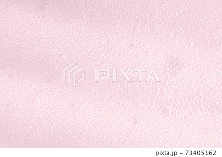 Pink foam macro background with bubbles. Soapy surface closeup. Foamy cleansing skin care product texture from soap, detergent, shampoo, shaving foam. Laundry spume Pink foam macro background with bubbles. Soapy surface closeup. Foamy cleansing skin care product texture from soap, detergent, shampoo, shaving foam. Laundry spume 73405162