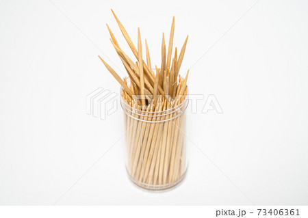 Wooden toothpicks sticking out plastic jar isolated white background 73406361