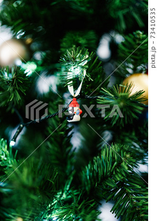 A Christmas tree toy in the shape of an Icelandic puffin, the national bird of Iceland, on the branches of a Christmas tree. A Christmas tree toy in the shape of an Icelandic puffin, the national bird of Iceland, on the branches of a Christmas tree. 73410535