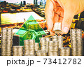 Exposure of Finance and Saving money banking concept,Hope of investor concept,Male hand putting money coin like stack growing business. background the city 73412782