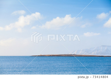 Icelandic landscape. Snowy mountains under clouds 73414804