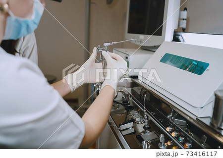 Doctor prepare to cleans tools of medical instruments 73416117