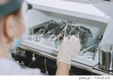 Doctor prepare to cleans tools of medical instruments Doctor prepare to cleans tools of medical instruments 73416120