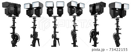 2 Speedlight flashes guns on tripod holder isolated on white background. 2 Speedlight flashes guns on tripod holder isolated on white background. 73422155