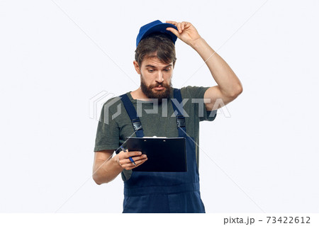 man in working uniform documents delivery loader transportation light background man in working uniform documents delivery loader transportation light background 73422612