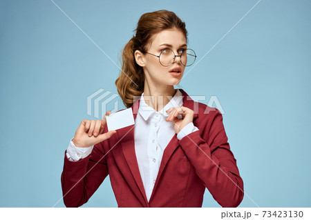 Elegant woman red jacket business card official confident lifestyle blue background Elegant woman red jacket business card official confident lifestyle blue background 73423130