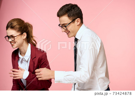 business man and woman office work colleagues team office management studio pink background 73424878