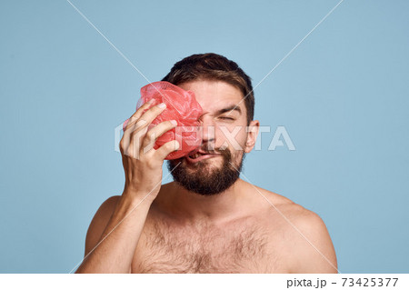 Bearded man with bare shoulders washcloth clean skin taking shower 73425377