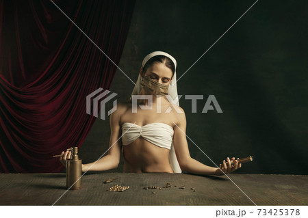 Modern remake of classical artwork with coronavirus theme - young medieval woman on dark background 73425378